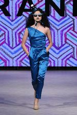 GRANDI Vancouver Fashion Week party girl teal one shoulder jumpsuit Black Iris lenses
